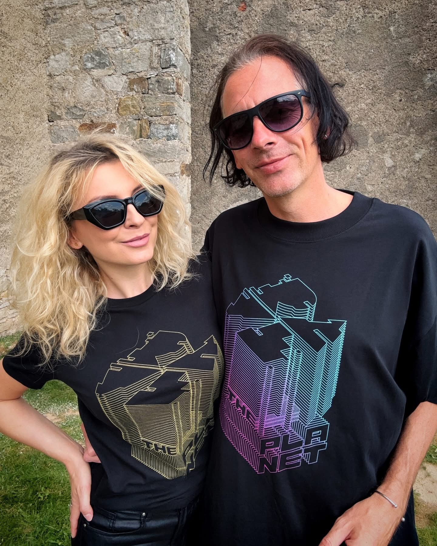 Ewelina and Marc wearing Rave The Planet T-shirts and sunglasses